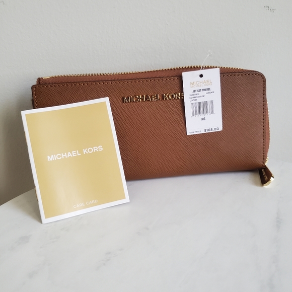 Michael Kors Handbags - NWT Brown Michael Kors Jet Set Travel Three Quarter Zip Around Leather Wallet